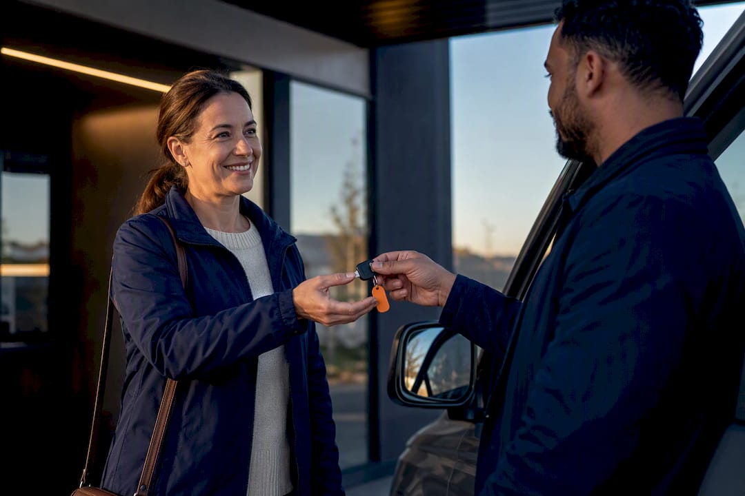 Church coordinator receiving rental vehicle key
