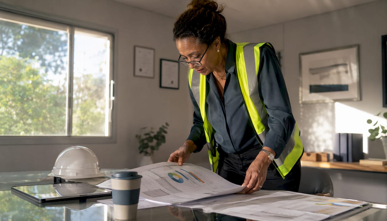 Project manager reviewing construction financial checklist