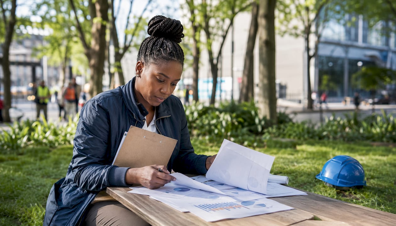 Engineer reviewing construction productivity reports