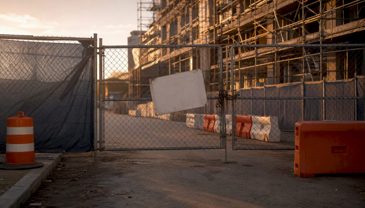 Hospital construction site with delay signage