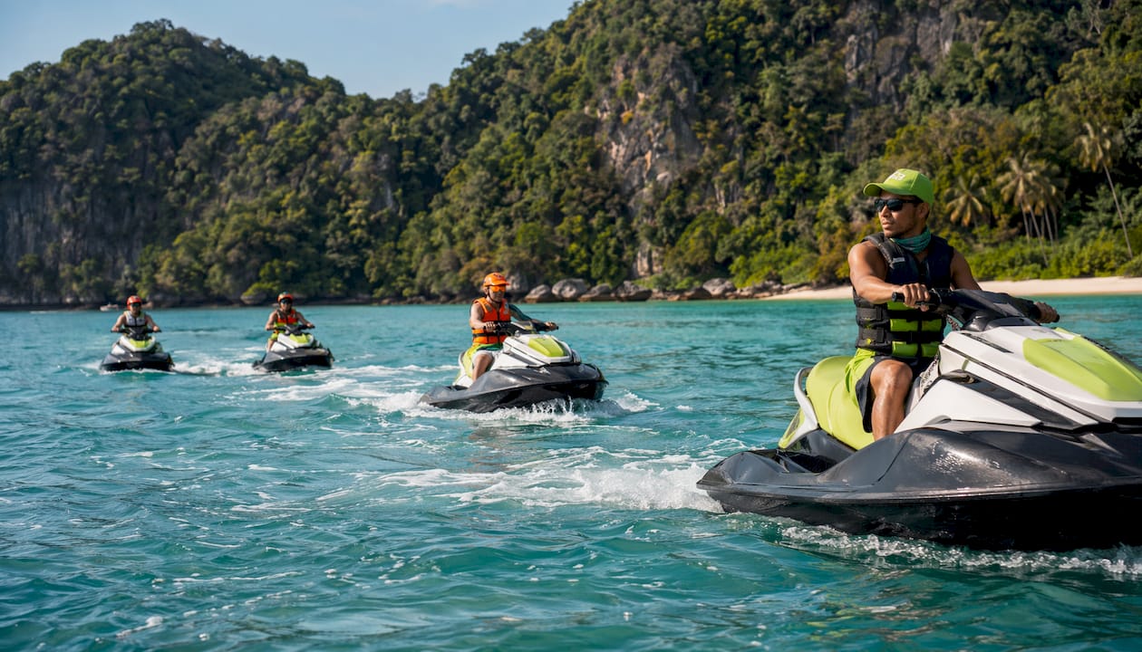 Group jet skiing during guided island tour