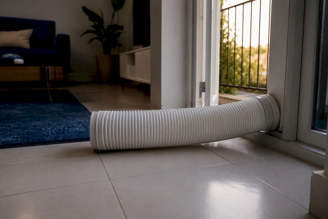 Short, gently bent portable AC exhaust hose close-up