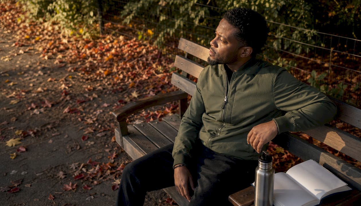 Man reflecting outdoors on identity and mental health