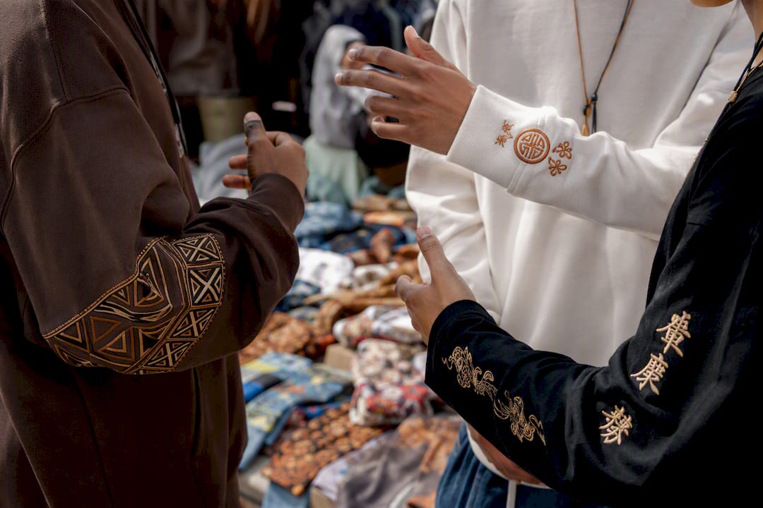 Close-up of multicultural streetwear details with motivational text
