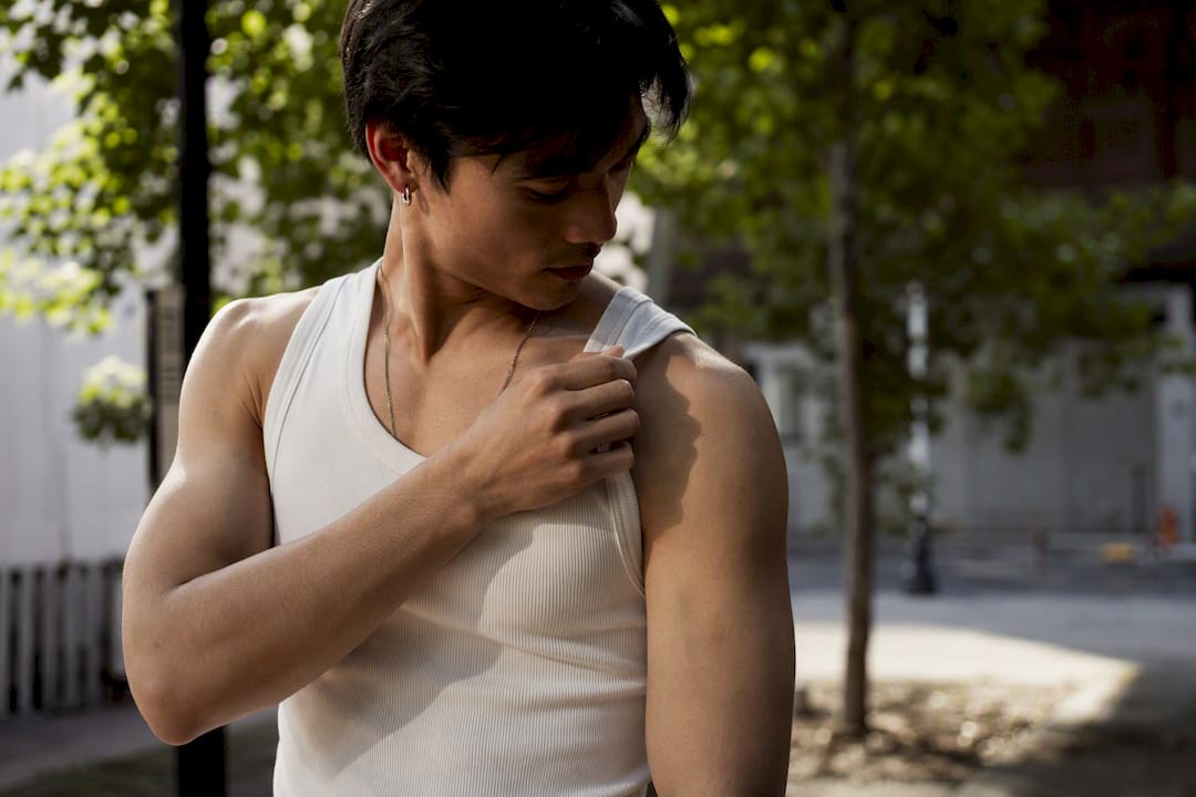 Close-up of wide strap tank top on shoulder