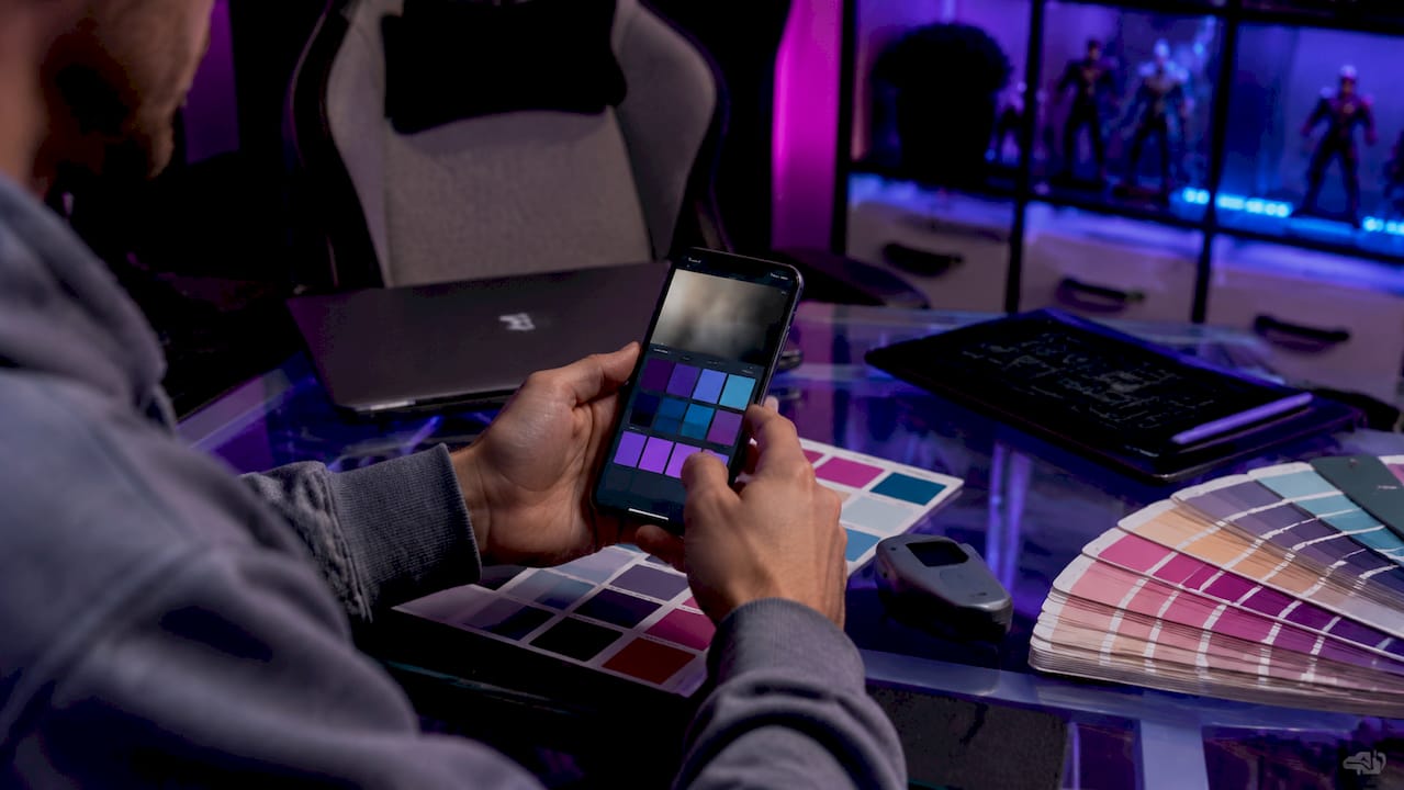 Hands extracting colors from webcam background on phone