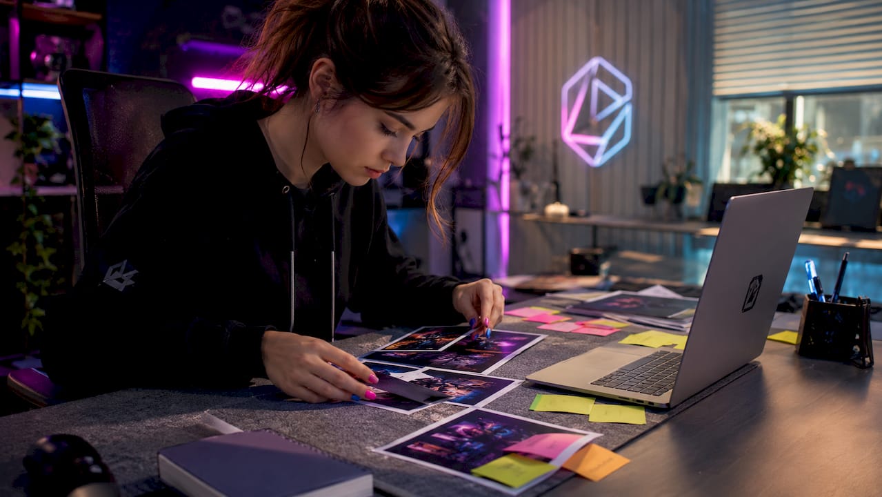 Hands arranging stream thumbnail workflow materials