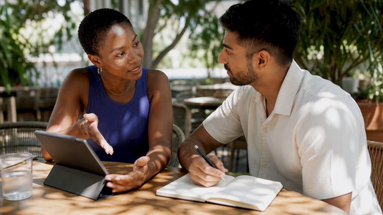 Landlord and manager discussing insurance documents