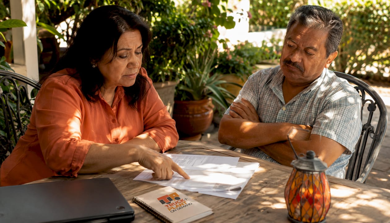 Couple reviewing auto insurance at kitchen table