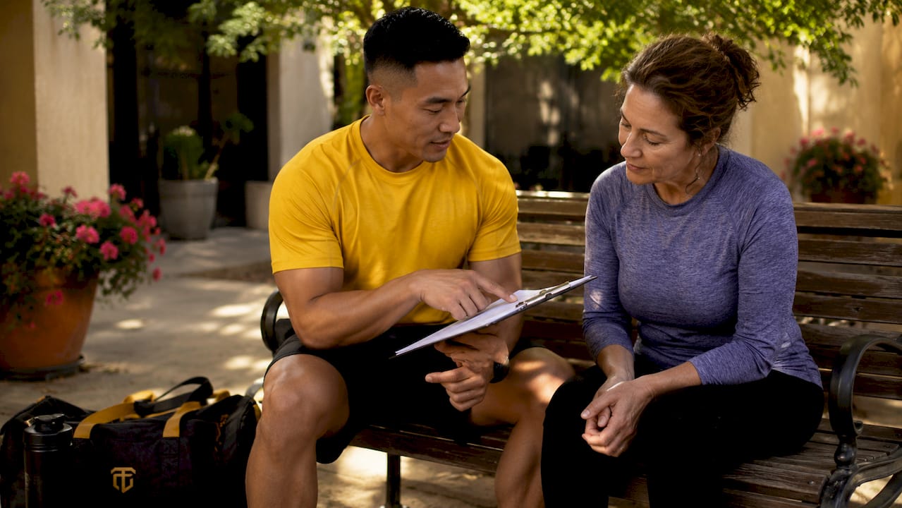 Trainer explaining contract terms to client