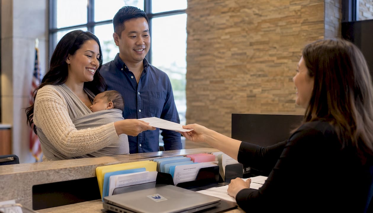 Family completing newborn passport appointment