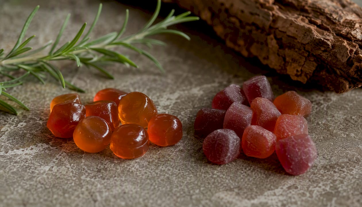 Different textures of gummy vitamins on wood