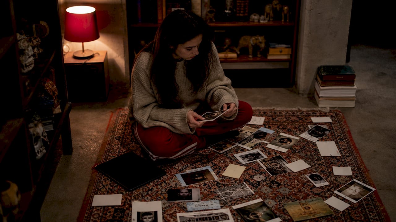 Person investigating mystery game clues at home