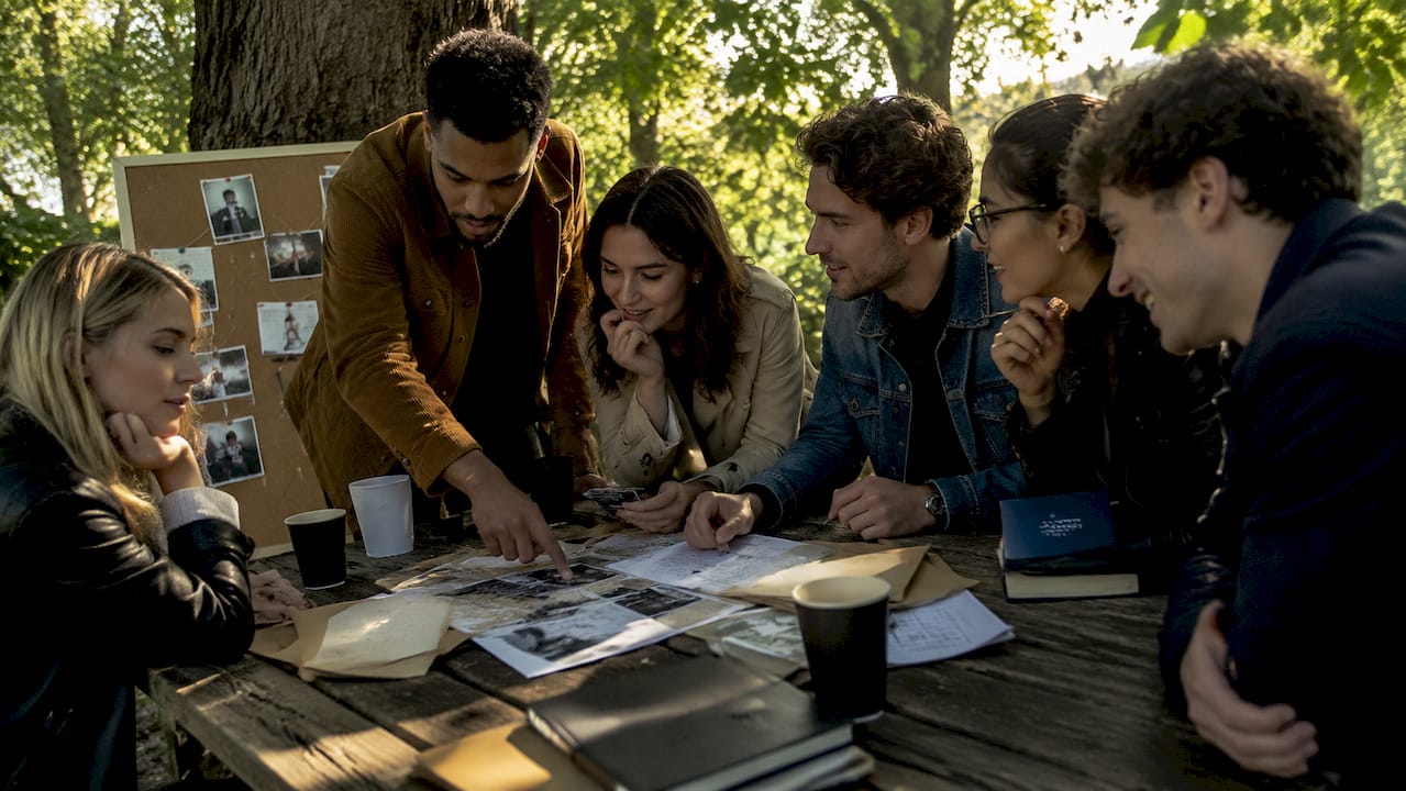 Group playing immersive mystery game together