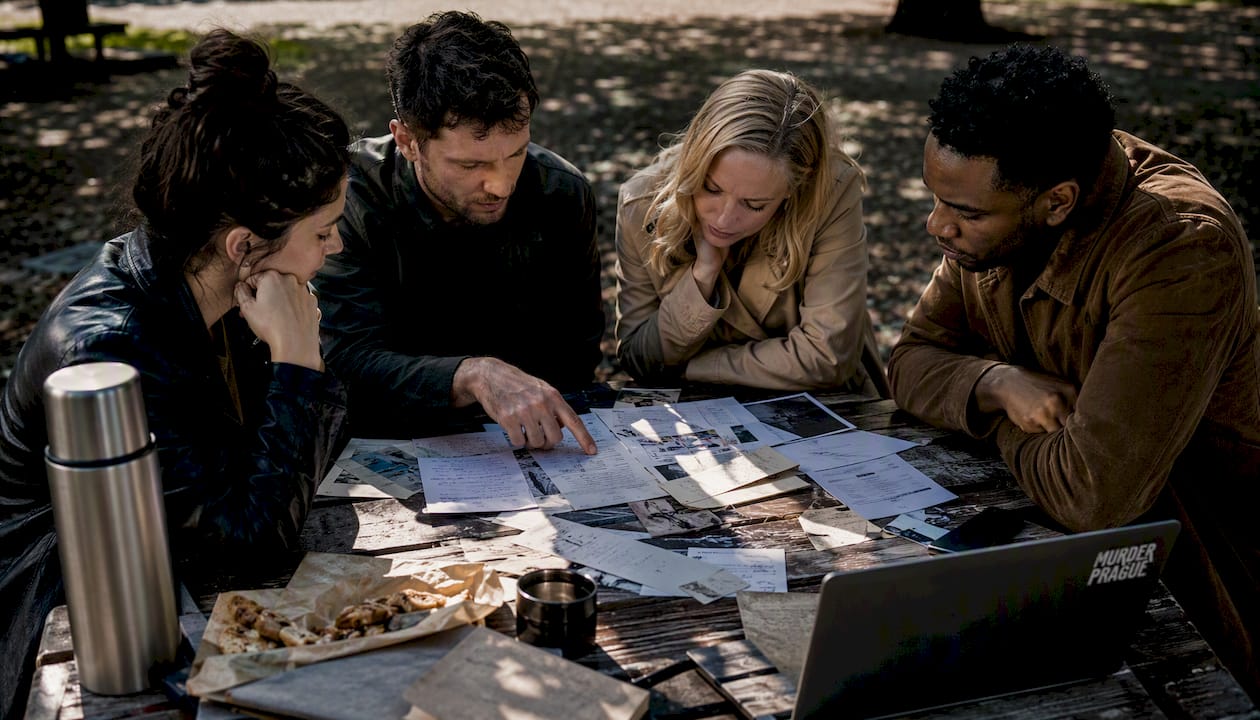 Group investigating physical evidence at table