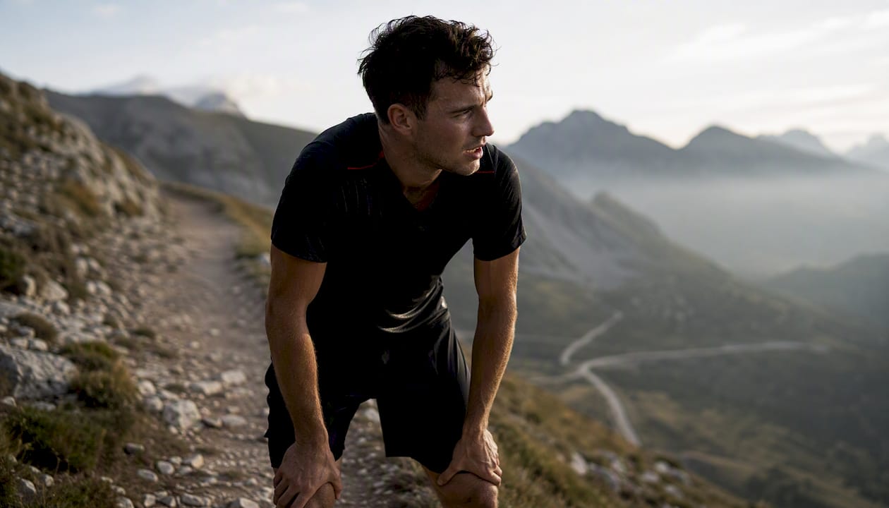Runner pausing in training showing courage