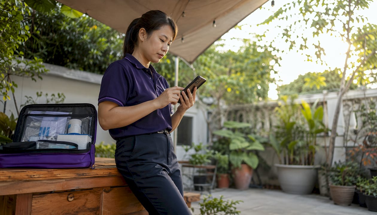 Facility manager reviewing digital first aid assessment on phone