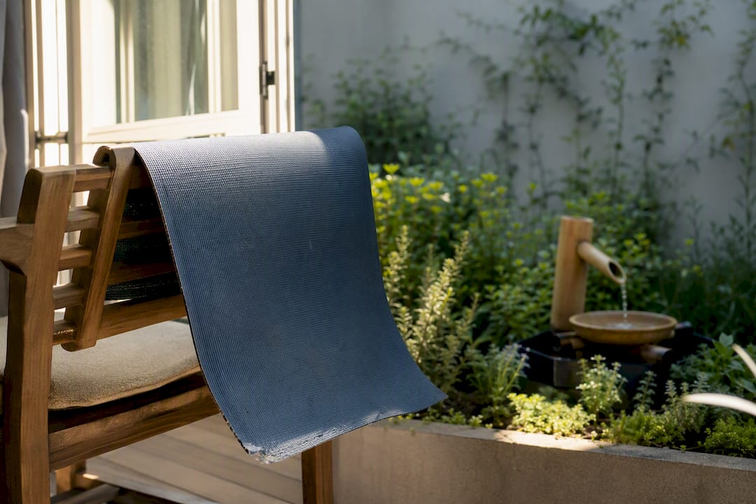 Yoga mat airing near open window in room