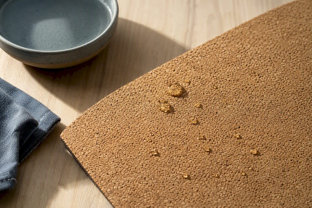 Water droplets beading on textured cork material