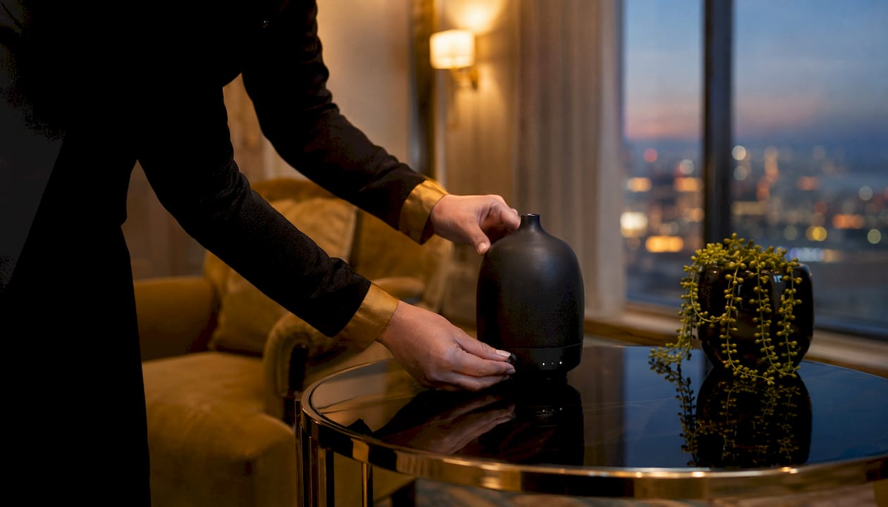 Hands adjusting event scent diffuser settings