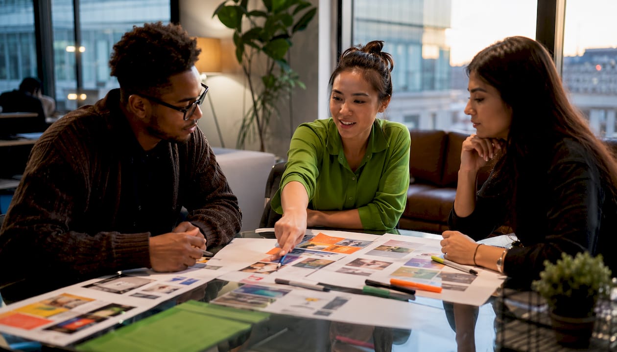Team discussing brand CTA strategy layouts