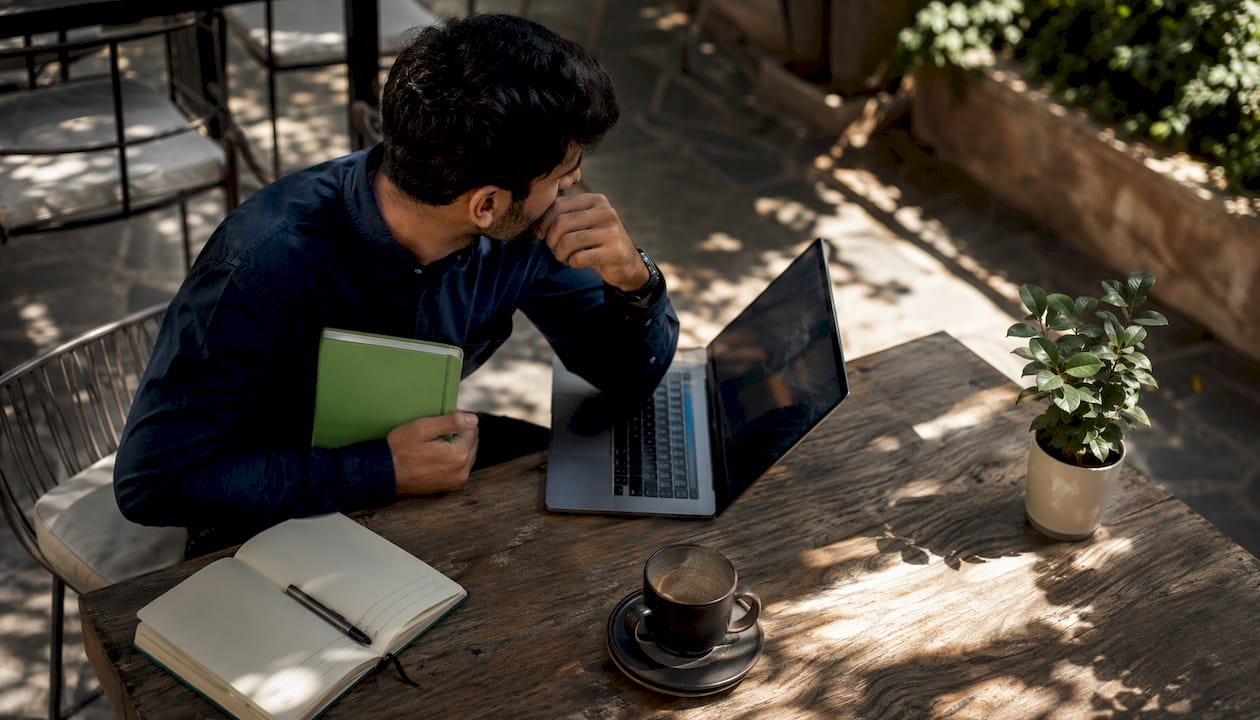 Man using financial risk management software laptop