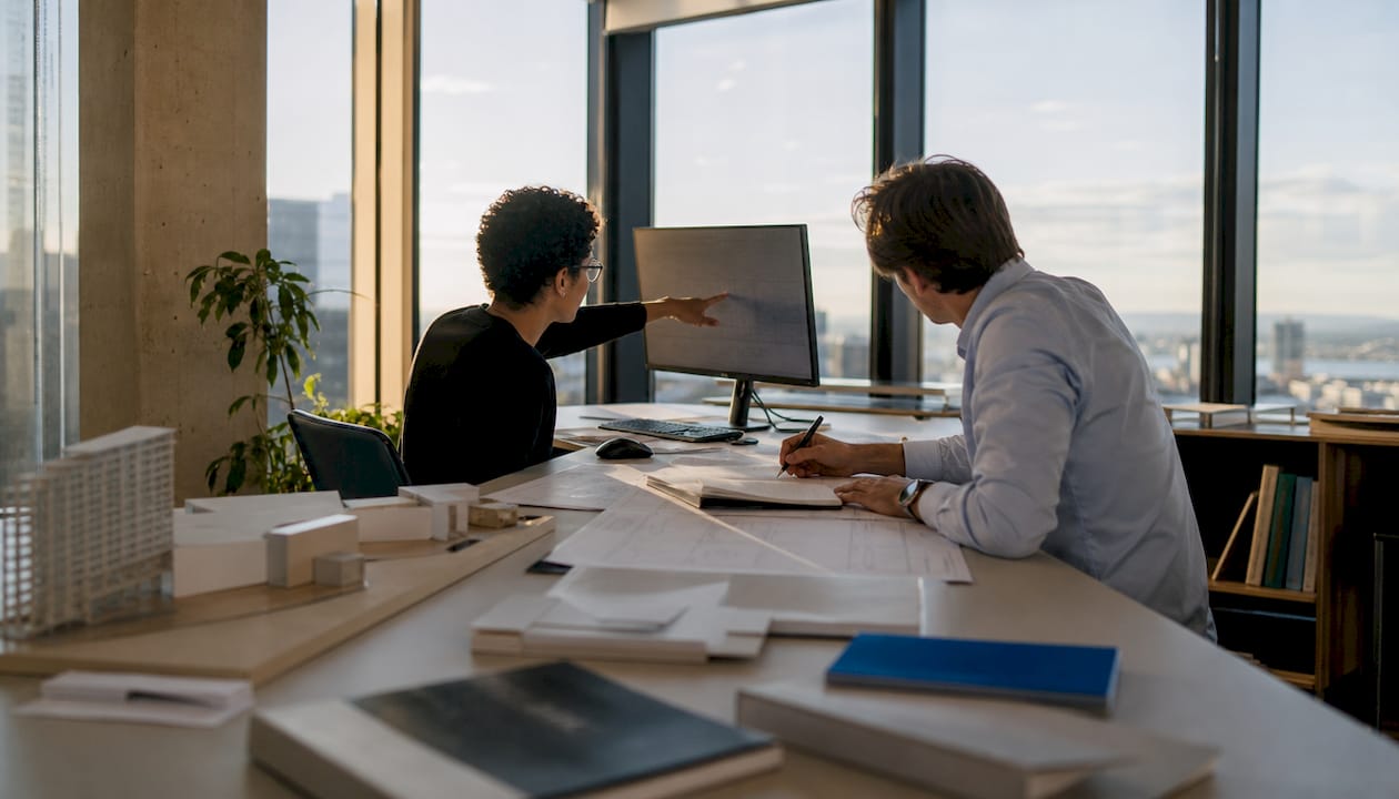 Architects collaborating on Revit grid alignment