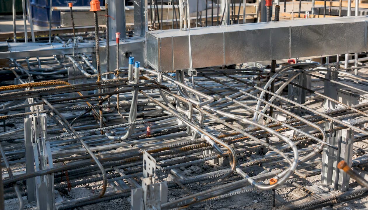 Intersecting rebar and ductwork at construction site