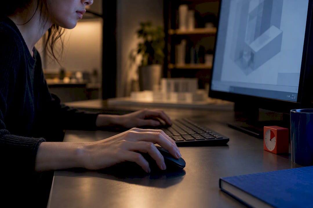 Hands completing a timed Revit modeling task