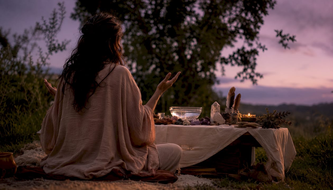 Quiet shamanic ritual space with candles and altar