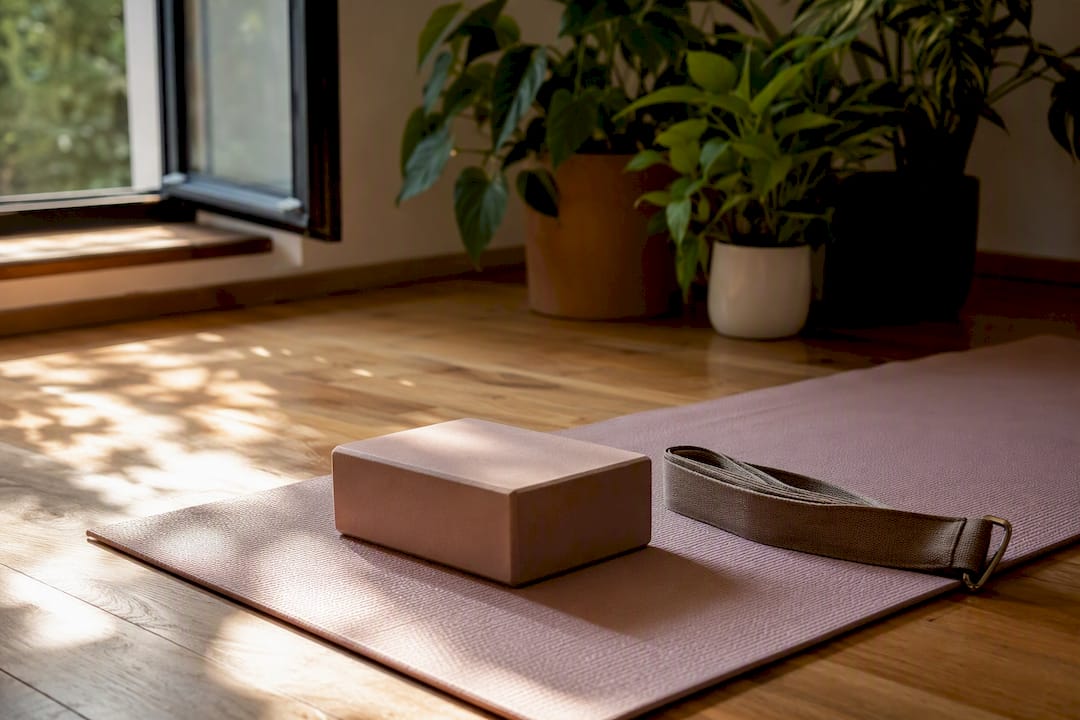 Yoga mat with props in sunlit room