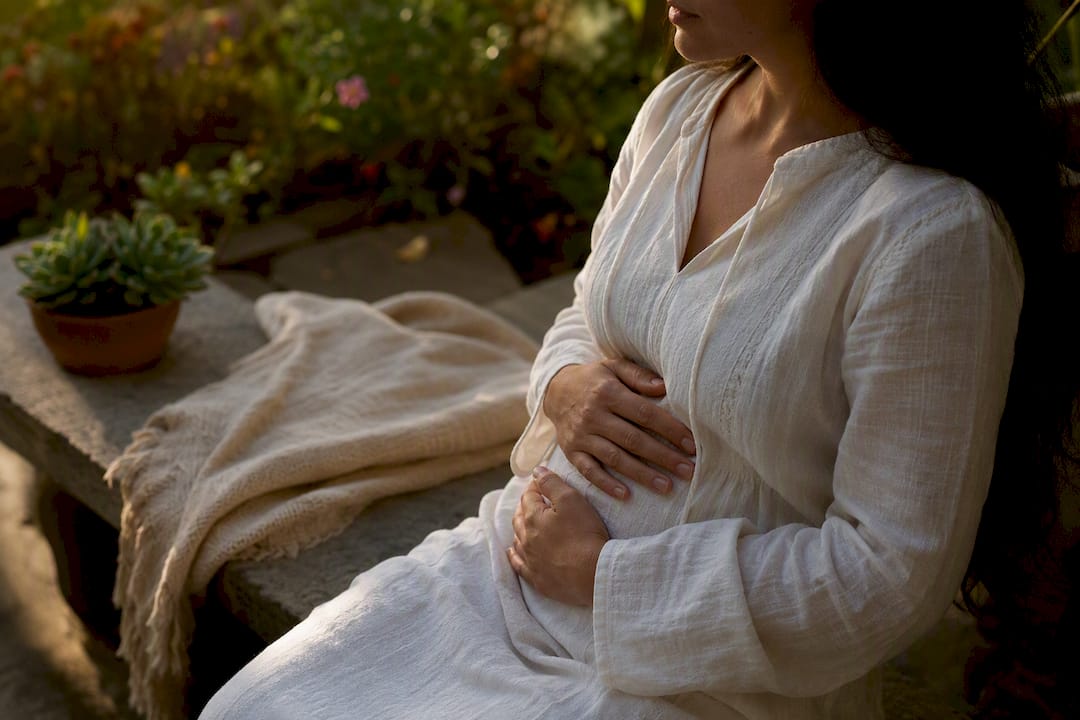 Hands gently resting on belly while breathing