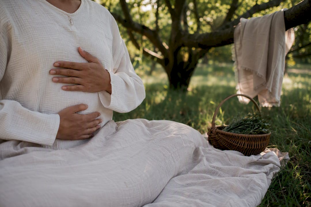 Hands resting on abdomen during breathwork