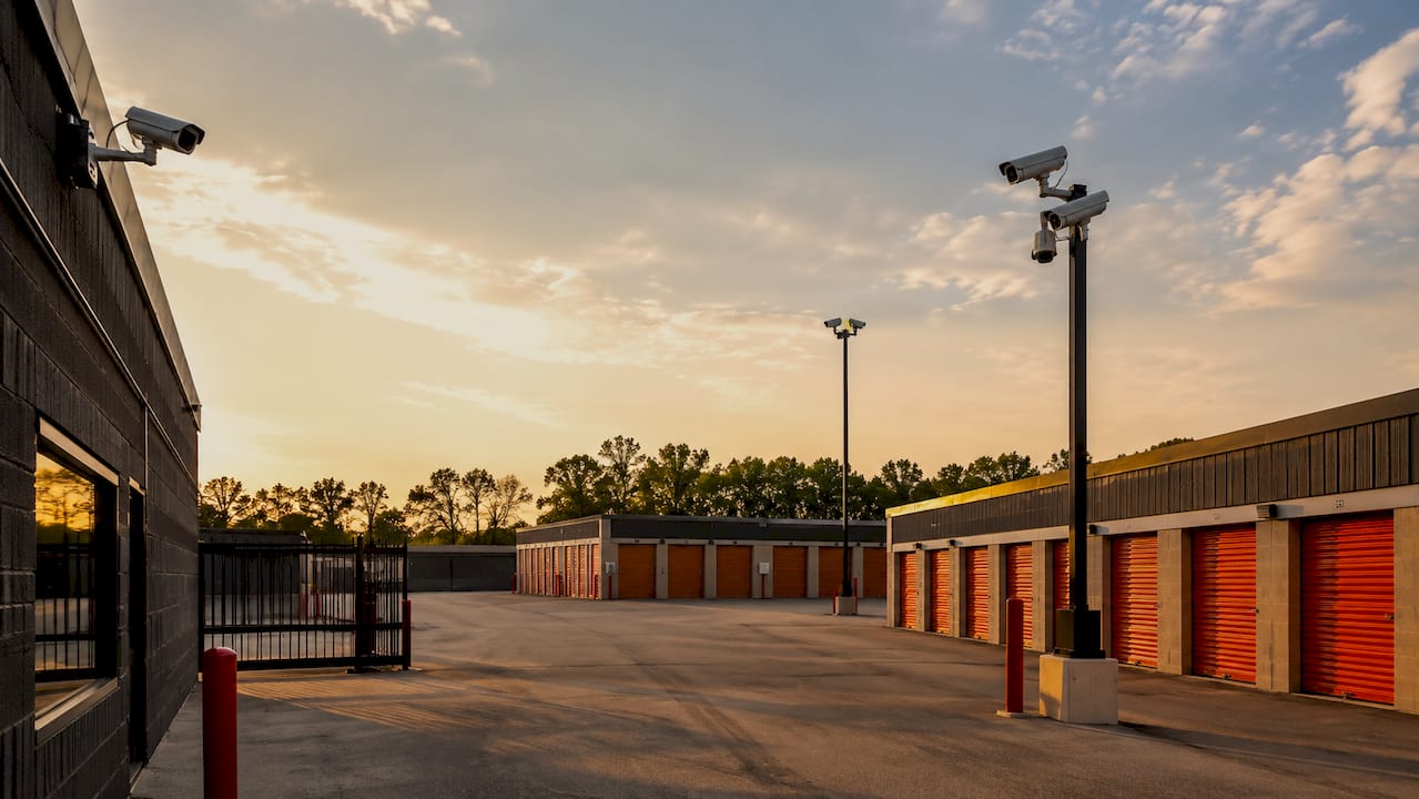 Wide view of cameras covering storage facility drive aisle and gate