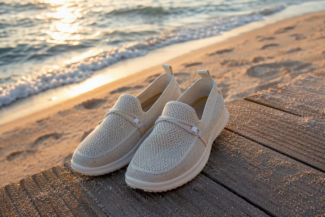 Slip-on sneakers with cotton pants on airport floor