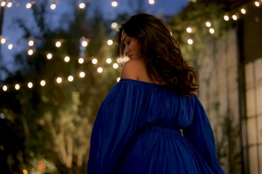 Jewel-tone off-shoulder dress at evening event