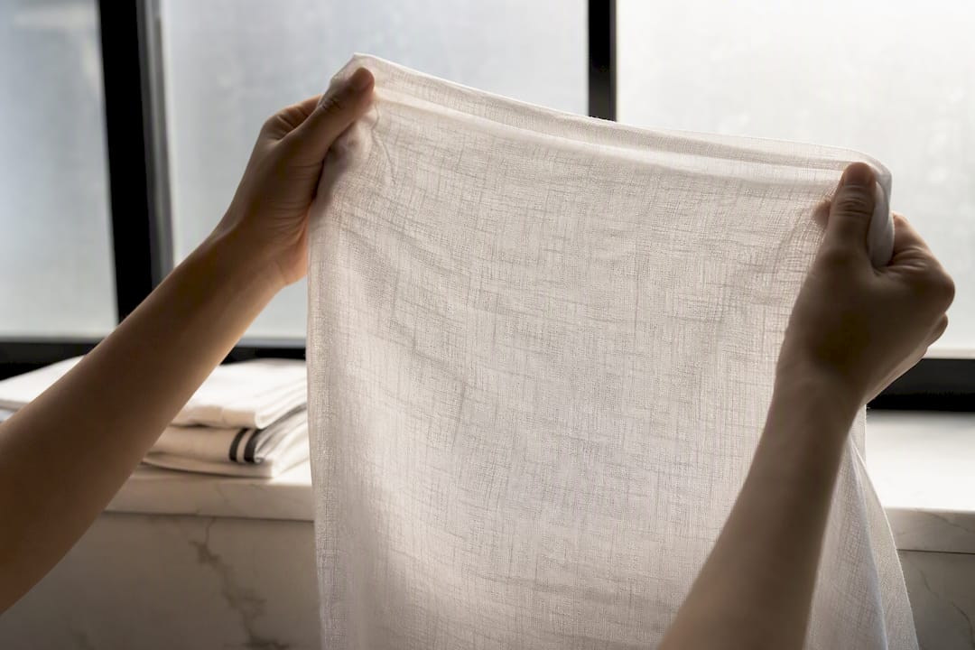 Cotton fabric checked against window light