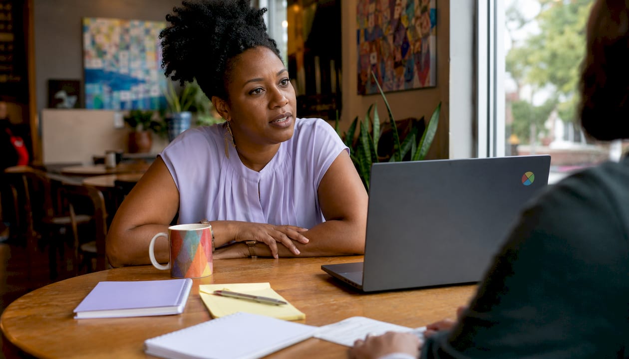 Woman showing thoughtful listening posture in coaching