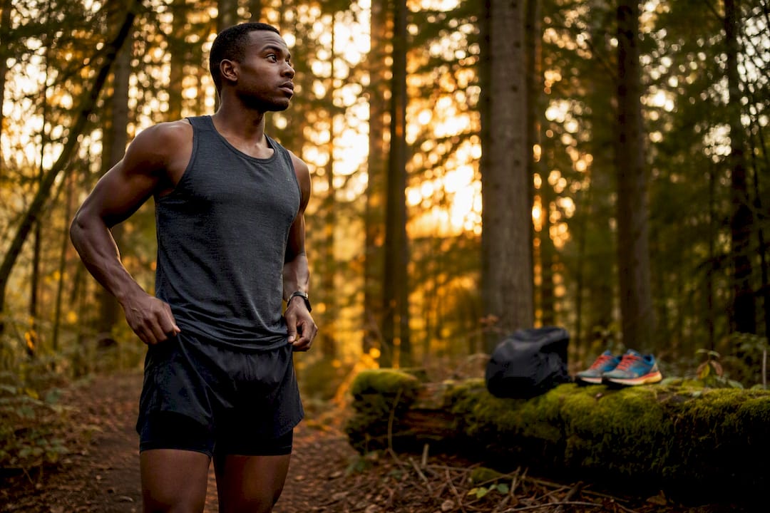 Runner adjusting short gym shorts outdoors