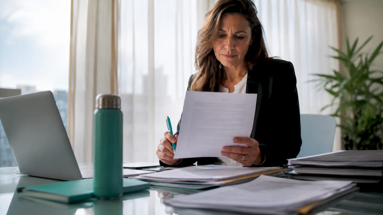 Lawyer reviewing land title documents