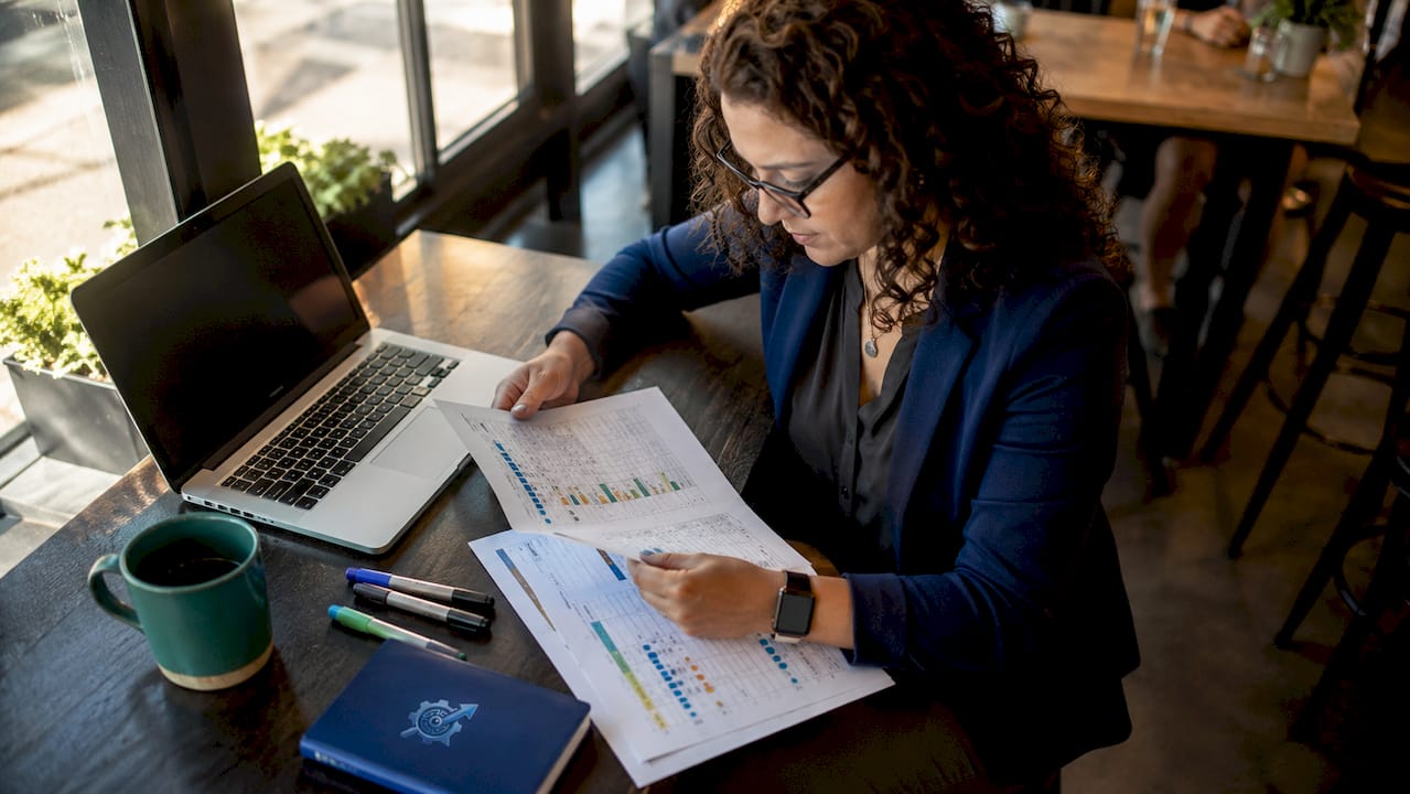 Woman reviewing sales candidate scorecards