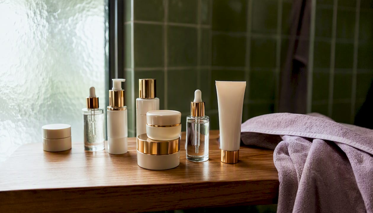 Close-up of skincare active ingredient bottles on table
