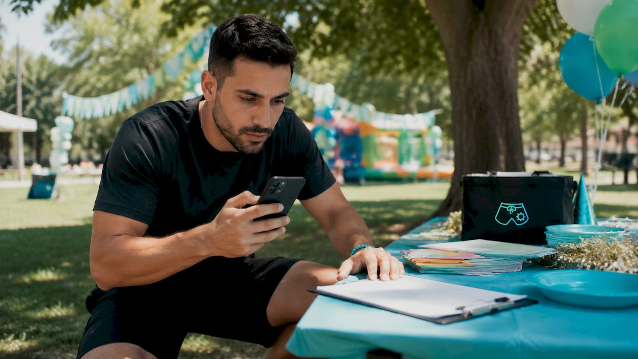 Hands reviewing entertainer insurance certificate on phone