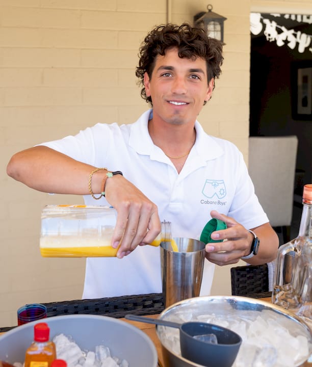 Man preparing buffet table indoors for party
