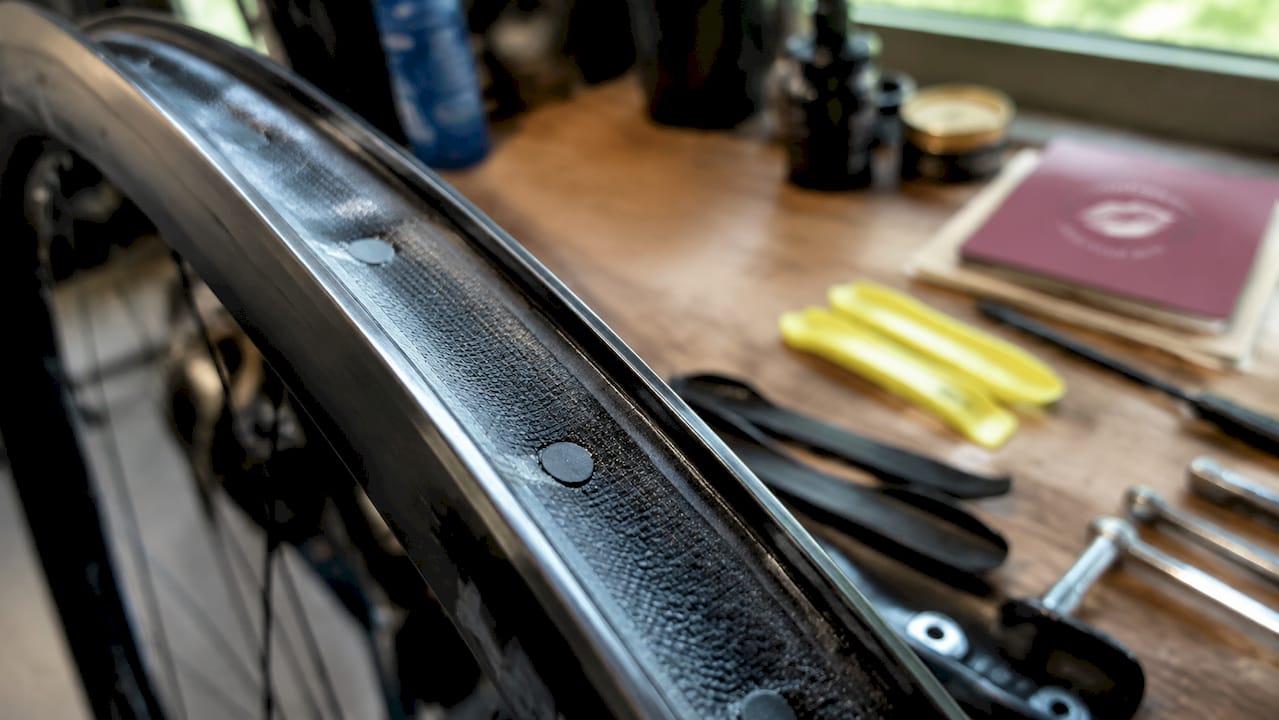 Close-up of tubeless rim tape on bike wheel