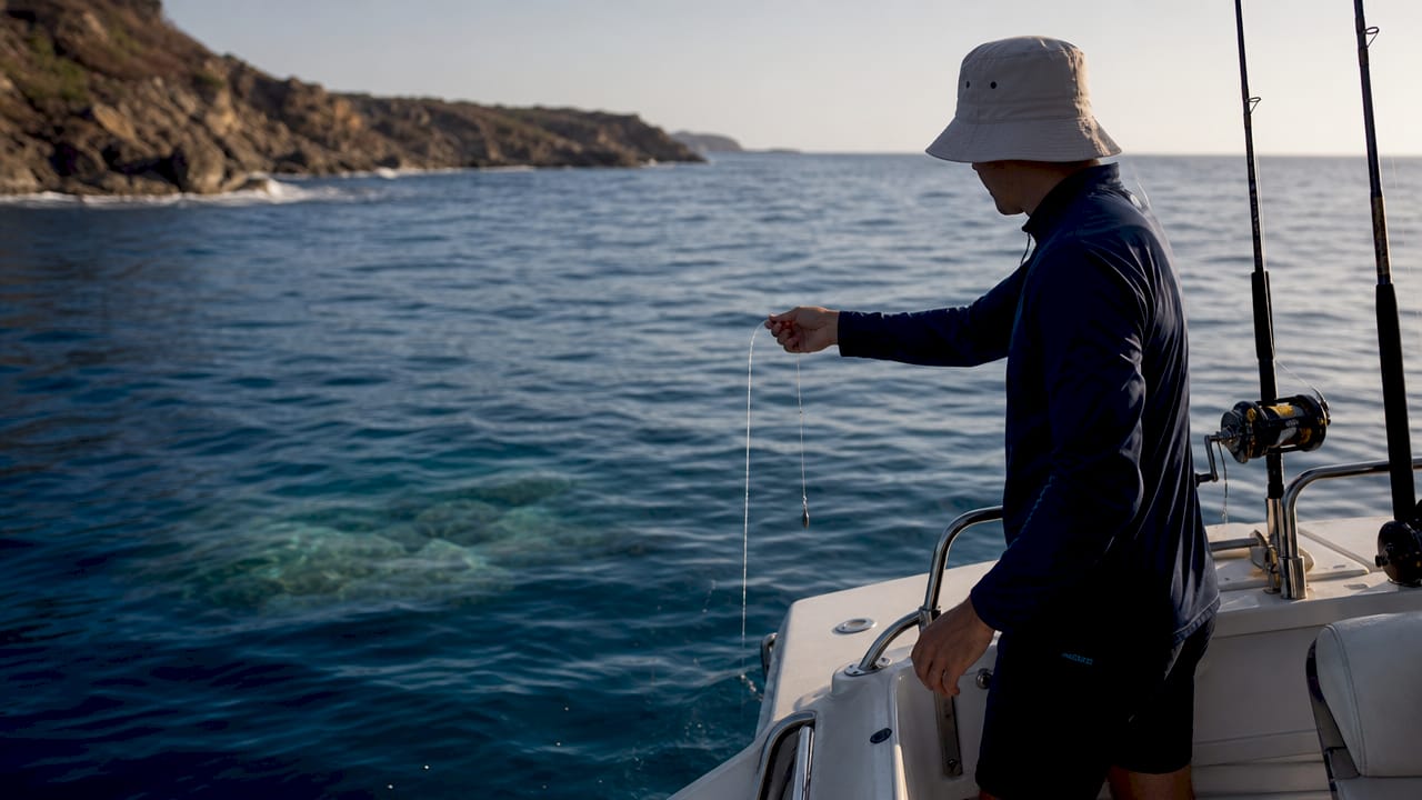 Angler measuring current near offshore seamount