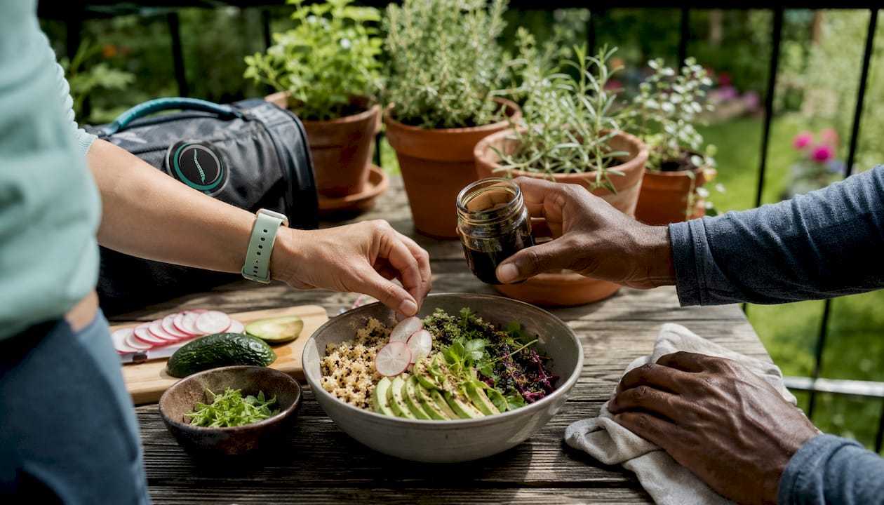 Hands preparing nutritious salad with protein and vegetables