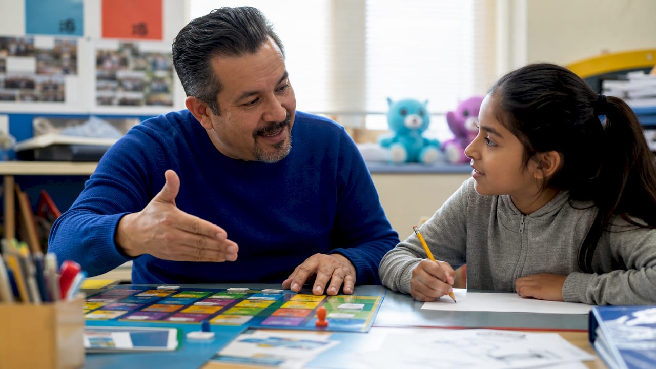 Teacher and student interacting over word game