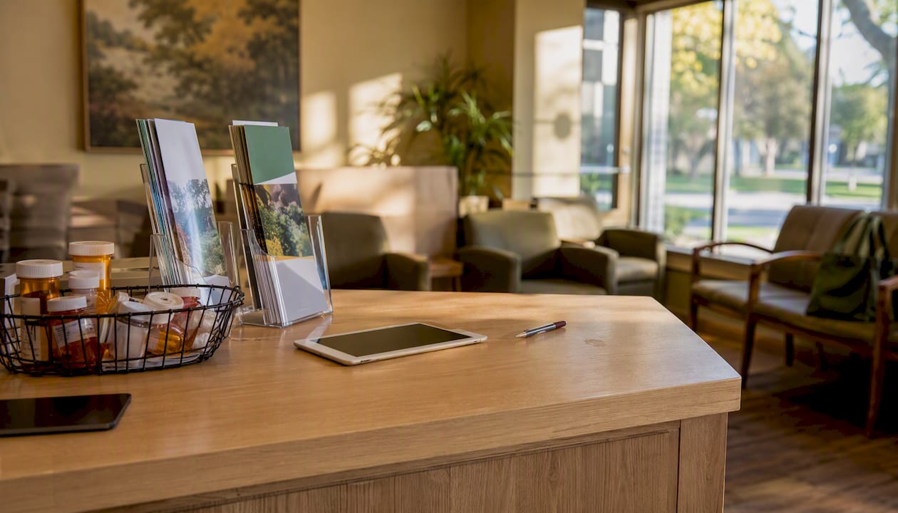 Healthcare reception counter with prescriptions and calculator