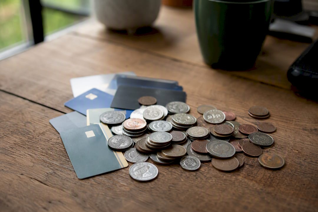 Coins and anonymous payment cards arranged on table